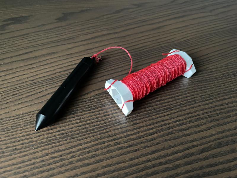 Plumb bob spool