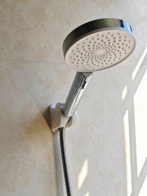 Adjustable shower head holder