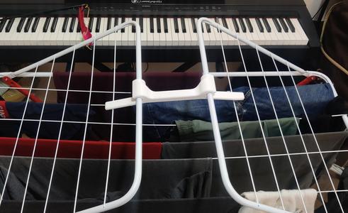 Clothes drying rack spacer