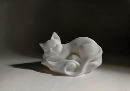 A sleeping kitten, an animal model art piece
