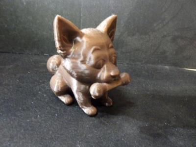 Small dog with a bone.