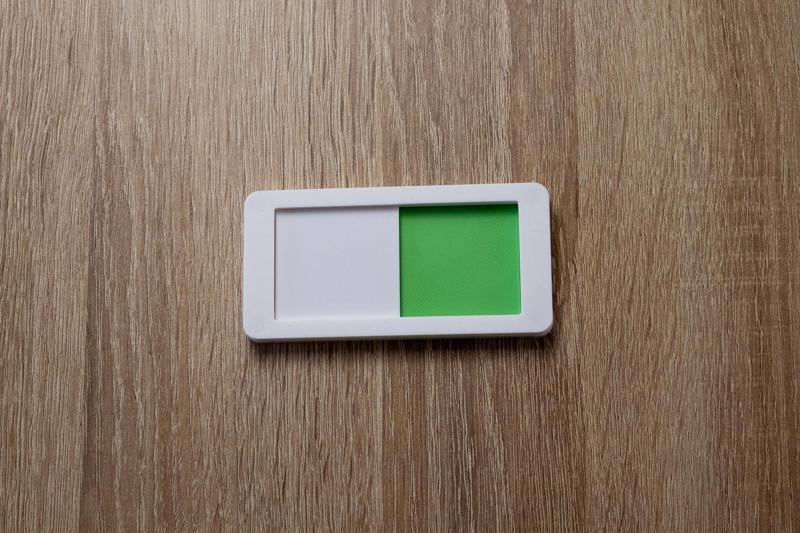 Dishwasher status slider, magnetic