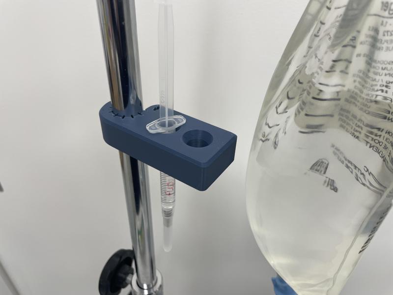 Syringe holder with IV pole clamp