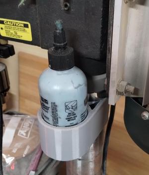 Cutting oil bottle holders for drill press