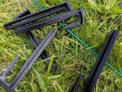 Signal cable holder for robotic lawnmowers