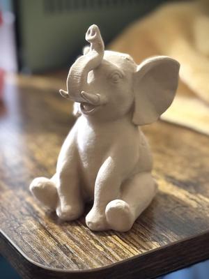Sitting Elephant with floral detailing