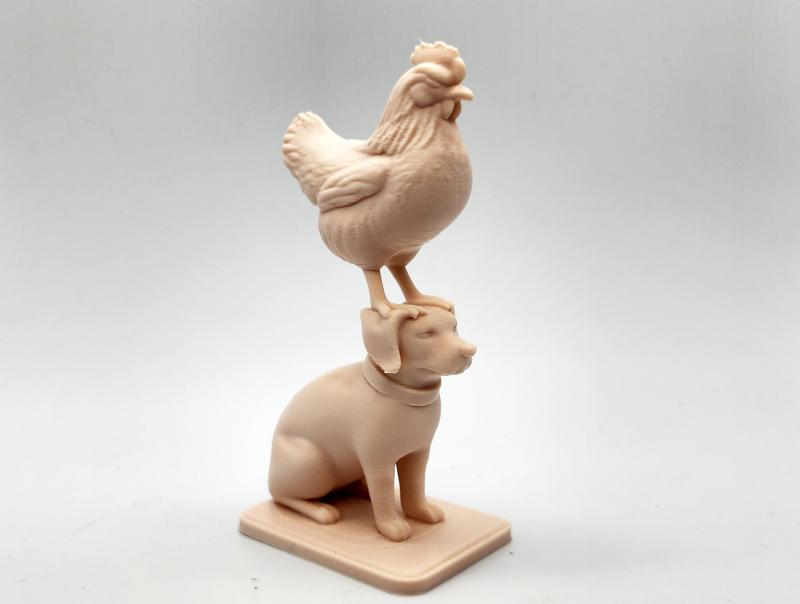 Chicken Standing on Dogs Head Figure