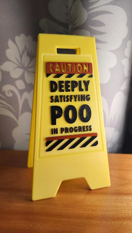 wet floor sign poo in progress