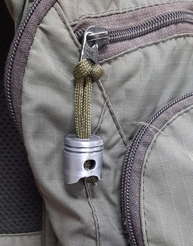 Piston paracord zipper pull