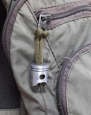 Piston paracord zipper pull