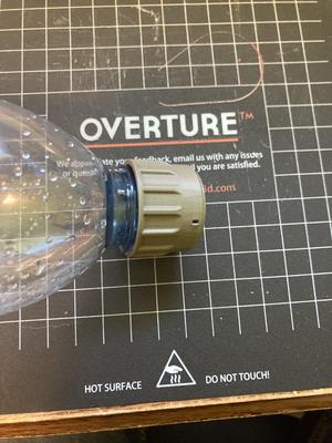 Bum Buddy with disposable water bottle threads
