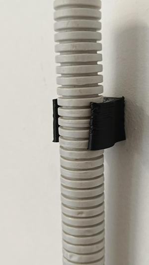 Wall clip for 16mm flexible conduit