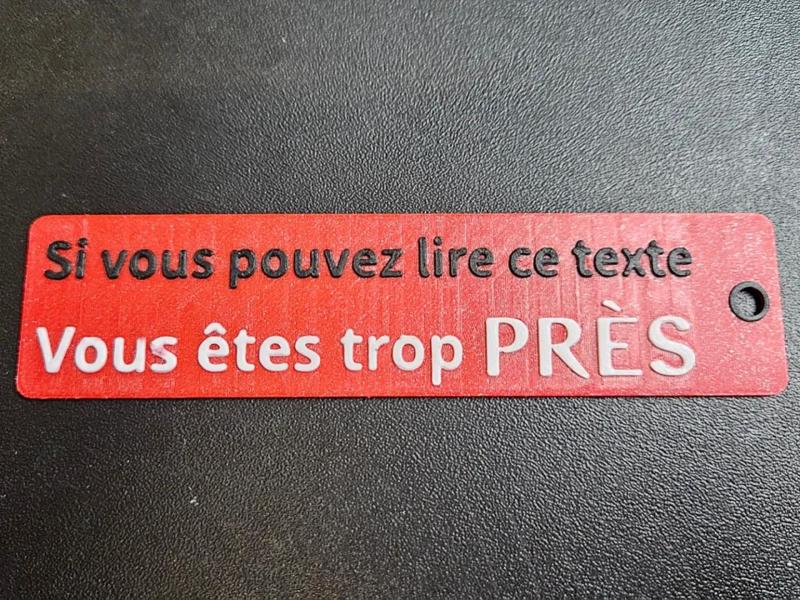 Porte clé flamme "Si vous pouvez lire ce texte"   