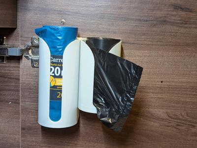 Trash bag roll holder