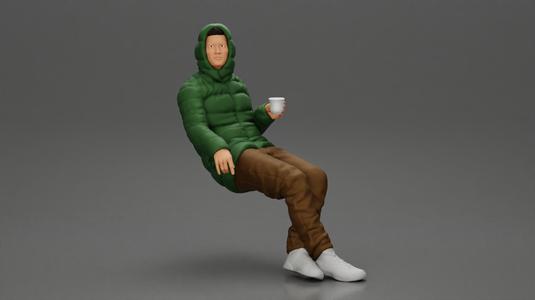 Man Sitting Wearing a Puffer Jacket, Holding a Coffee Cup