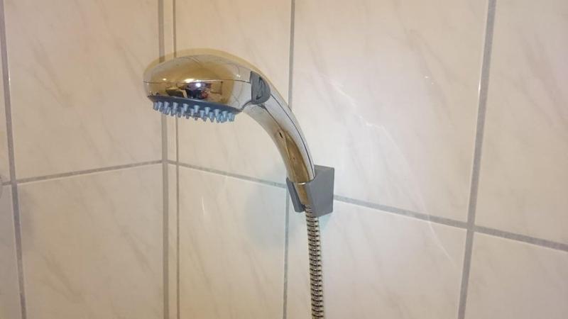 Shower head holder for wall