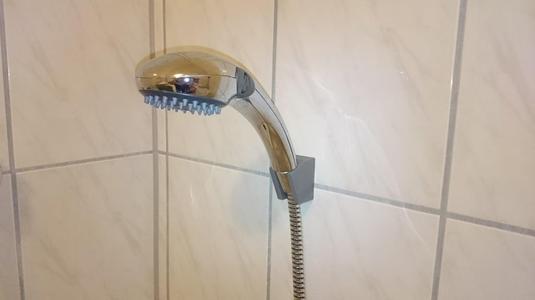Shower head holder for wall
