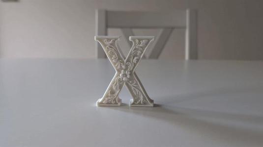 Standing Letter X in a Gypsum Floral Style