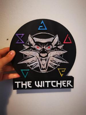 Witcher logo with a stand