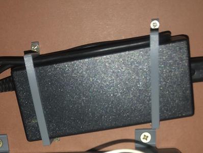 Universal small power supply holder