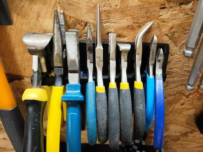 Asymmetric Pliers Holder