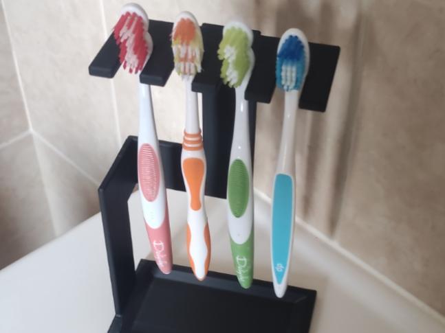Designer toothbrush holder