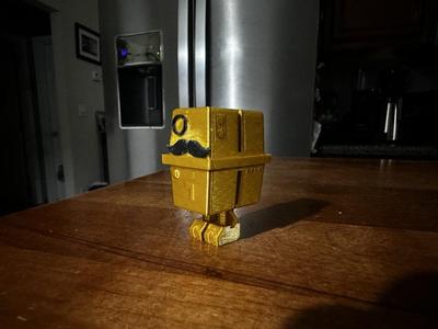 Gold Gonk Droid with Mustache and Monocle
