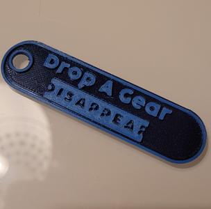 Drop A Gear Disappear key tag