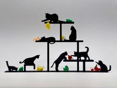 Cats play with balls of yarn