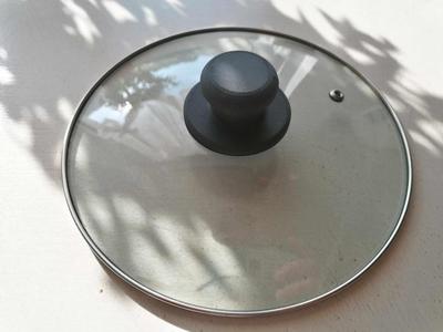 Handle on the cooking lid