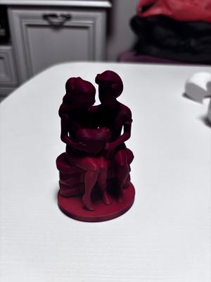 two lovers holding a heart valentine day decoration