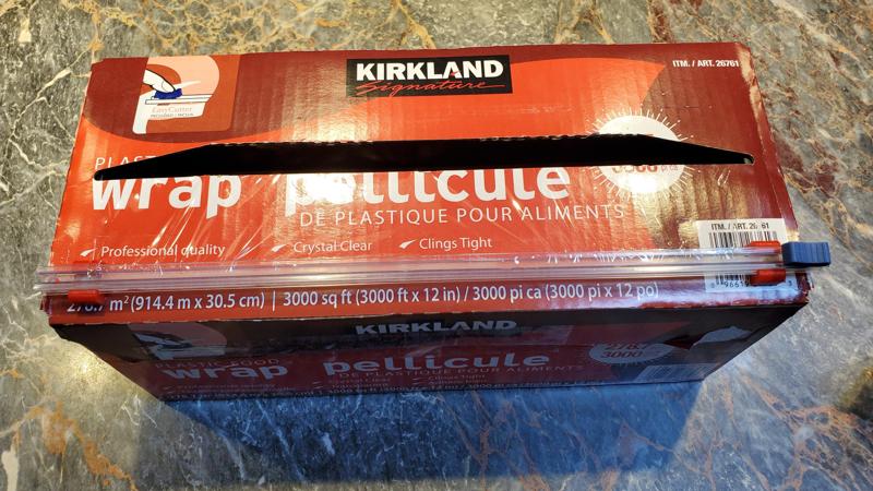 Cutter bracket for plastic-wrap dispenser