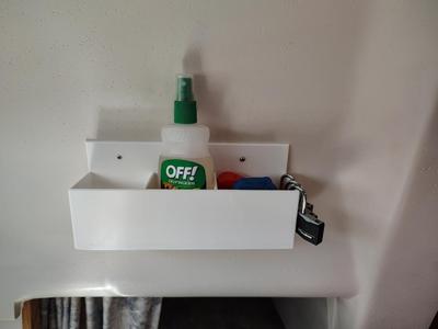 Holster for handheld VHF and other accessories for mounting on a boat bulkhead