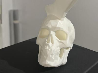 Low-poly skull with axe