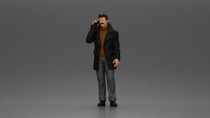 Turkish man in a coat with sweater standing talking on the mobile phone