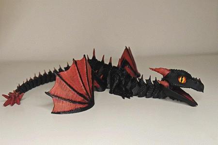 Articulated dragon with movable jaw