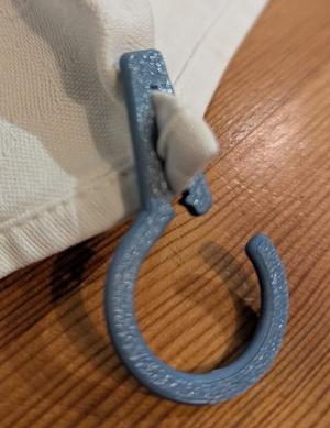 Towel hooks with internal teeth