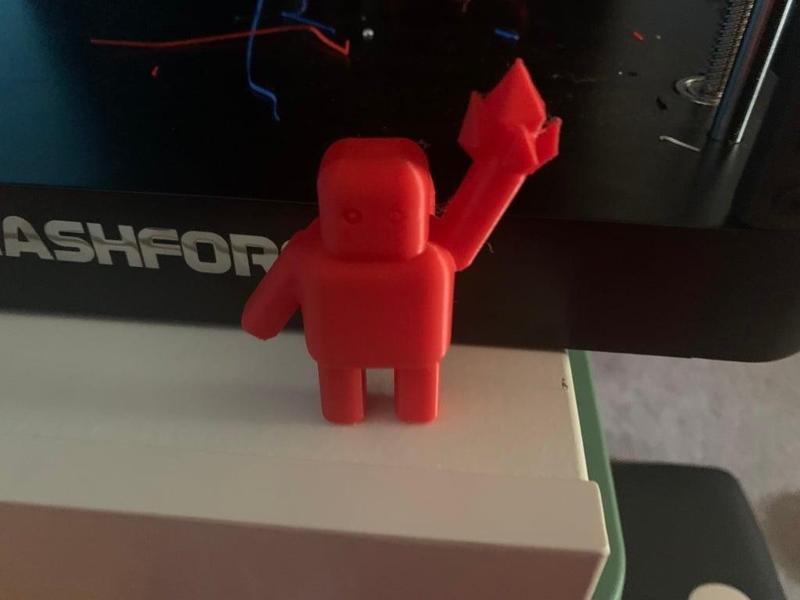 robot holding a crystal (on a stand)