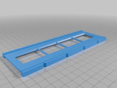 A frame for the Plustek 8200i scanner designed for scanning 35mm film (negatives) without cutting the film