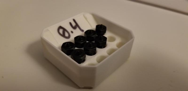 MultiBin nozzles, integrated label holder