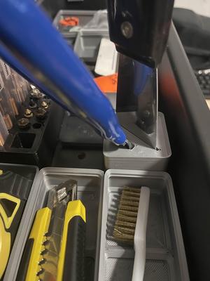 Gridfinity holder for pliers and scraper.