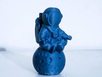 Meditating astronaut sculpture