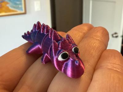 Articulated baby dragon fidget toy keychain