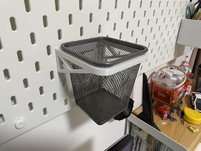 A SKADIS pegboard hook designed for IKEA's Dokkum iron square pencil holder