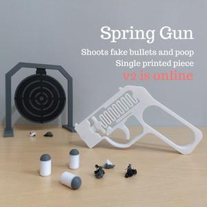 Spring Gun - Shoots fake bullets and poop