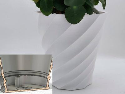 Flower pot with built in reservoir