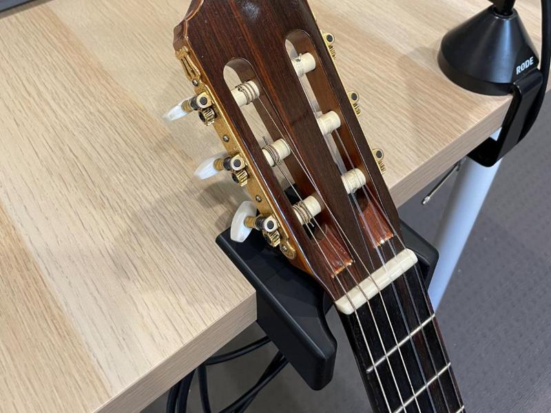 Guitar holder for a table