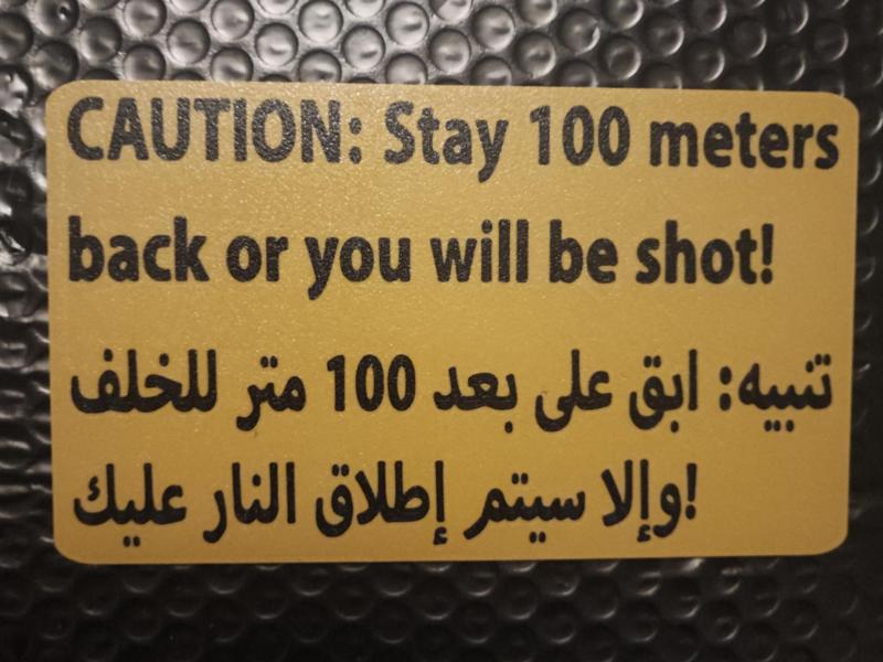 caution stay 100m back sign