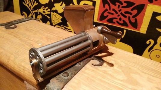 Small rotating, shell ejecting gatling gun