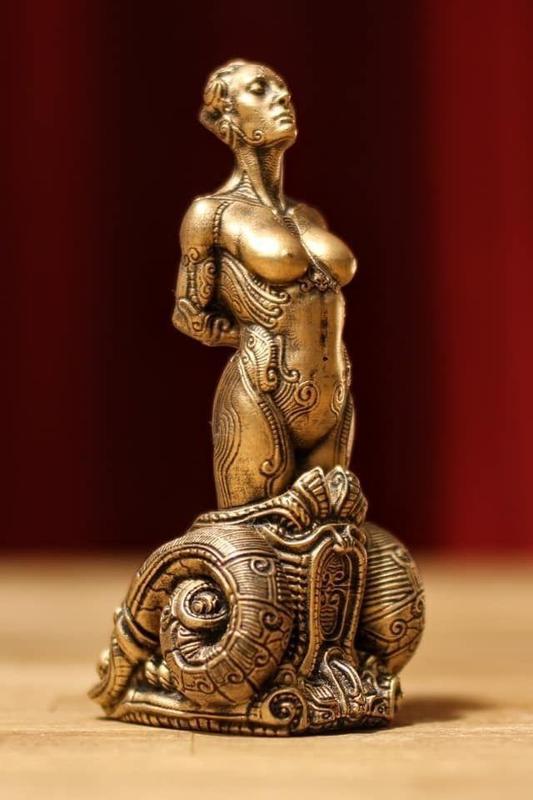 Bound bronze statue of woman